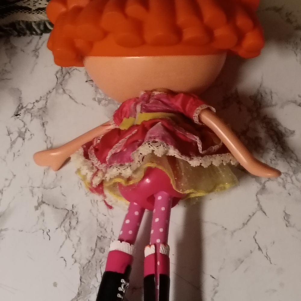 Colorful Doll with Orange Hair and Pink Dress